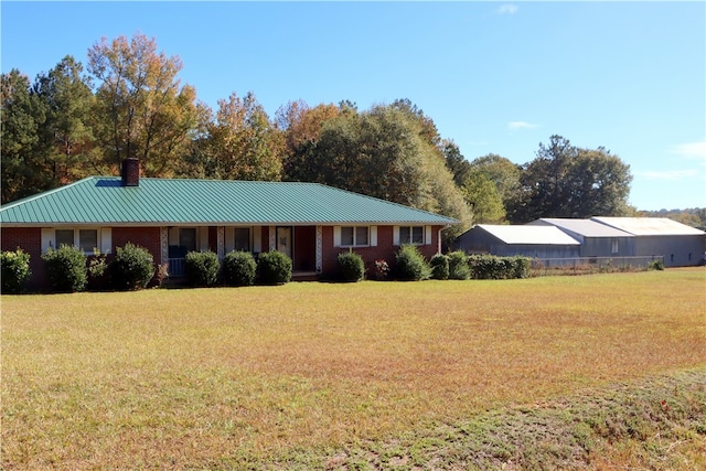 ranch-style home with a front lawn