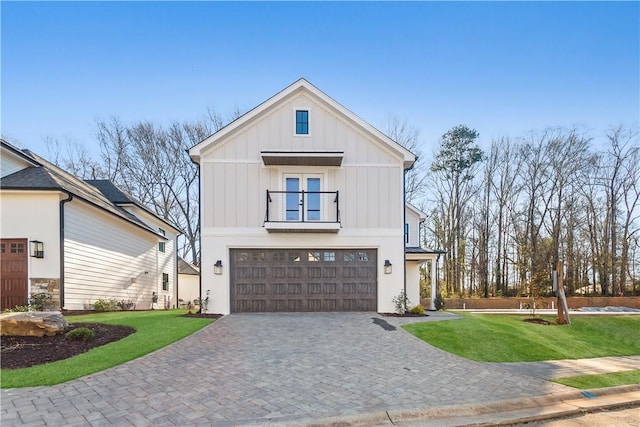 modern farmhouse with a garage and a front yard