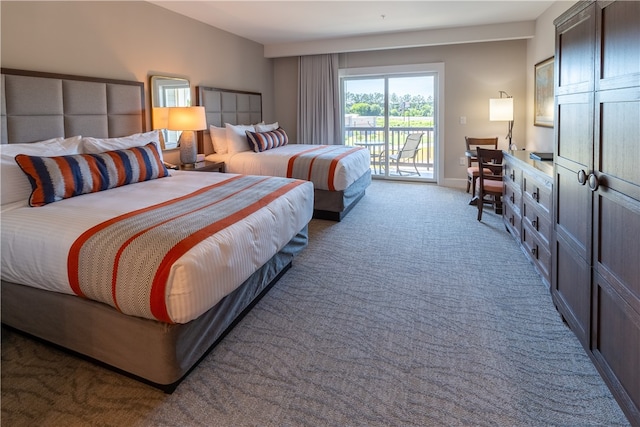 bedroom featuring access to exterior and carpet floors