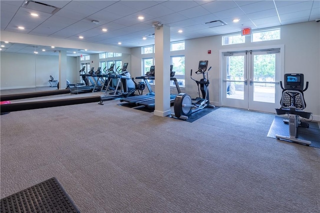 workout area with carpet floors, french doors, a paneled ceiling, and recessed lighting