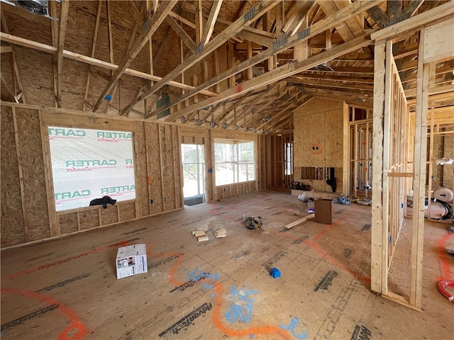 miscellaneous room with lofted ceiling