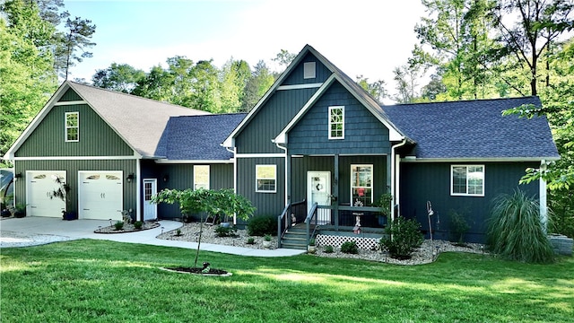 view of front of home featuring a garage, a porch, and a front lawn