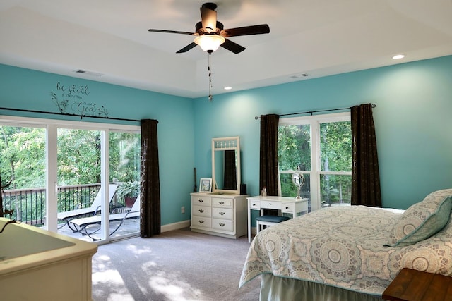 bedroom with light carpet, multiple windows, access to outside, and ceiling fan