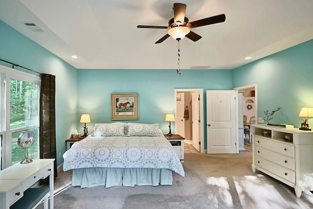 carpeted bedroom featuring ceiling fan