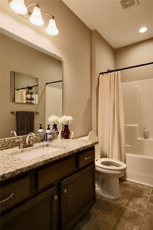 full bathroom featuring vanity, toilet, shower / bathtub combination with curtain, and tile patterned floors