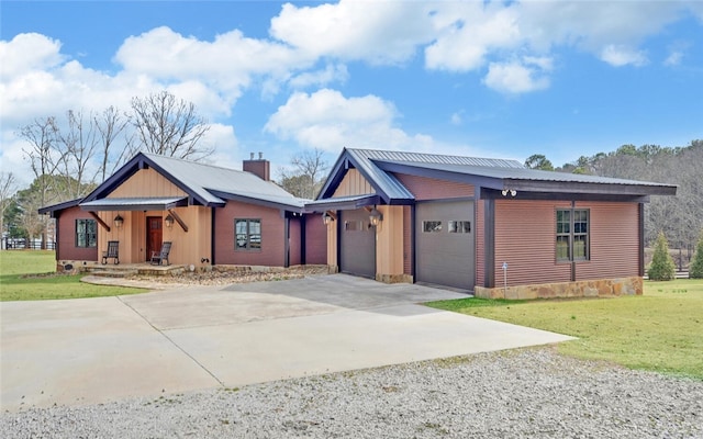 view of front of house featuring a garage and a front lawn