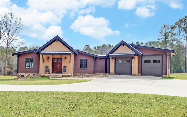 view of front facade featuring a garage and a front lawn