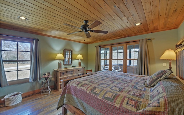 bedroom with wood ceiling, ornamental molding, hardwood / wood-style floors, and ceiling fan