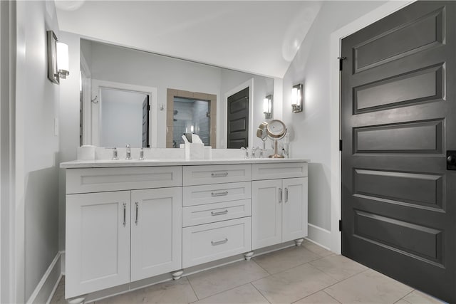 bathroom with walk in shower, vanity, and lofted ceiling