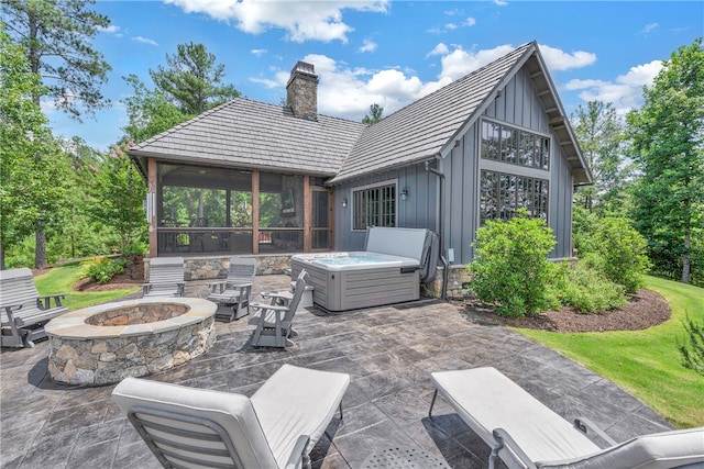 view of patio featuring a fire pit and a hot tub