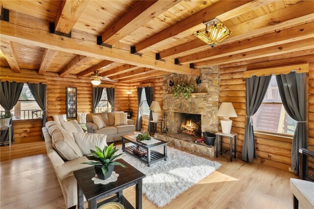 728 Tall Oak Trl, Seneca, SC 29678 - living room with beam ceiling, light hardwood / wood-style flooring, log walls, wooden ceiling, and a fireplace