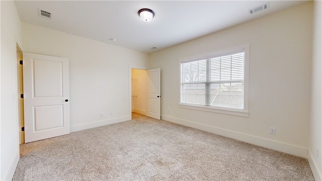 unfurnished bedroom with light carpet