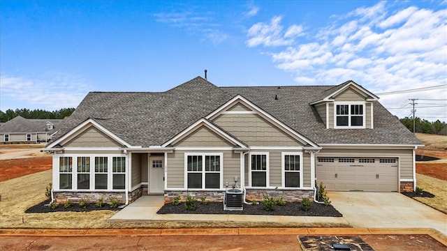 170 Preston Ridge Dr, Seneca, SC 29672 - craftsman house featuring stone siding, driveway, central air condition unit, and roof with shingles