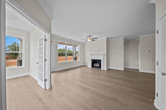 170 Preston Ridge Dr, Seneca, SC 29672 - unfurnished living room with ornamental molding, baseboards, ceiling fan, light wood-style flooring, and a fireplace