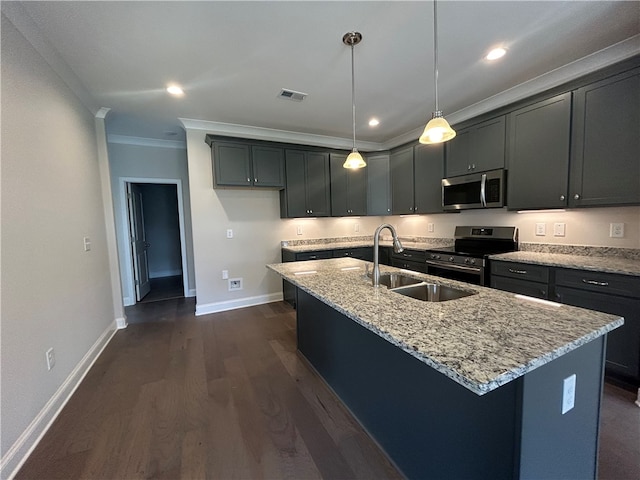 kitchen with stainless steel appliances, a kitchen island with sink, sink, light stone countertops, and dark wood-type flooring