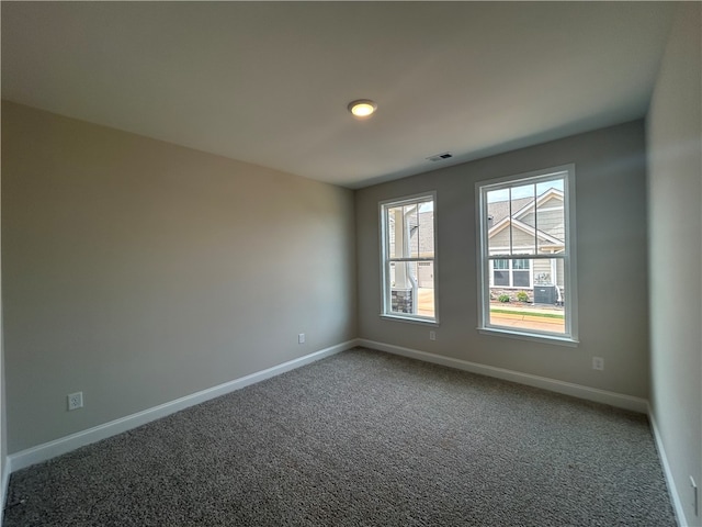 unfurnished room with carpet floors