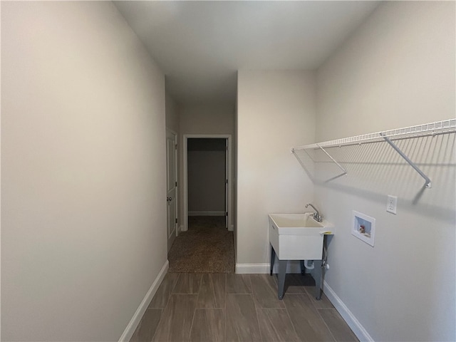 laundry room featuring carpet flooring and washer hookup