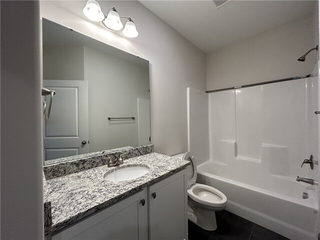 full bathroom with shower / bathing tub combination, tile patterned floors, vanity, and toilet