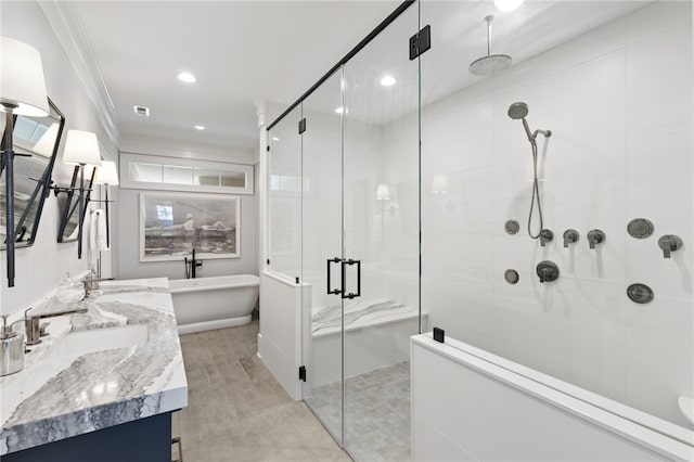 bathroom featuring separate shower and tub, crown molding, and vanity