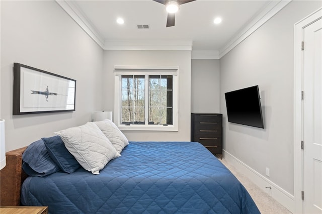 bedroom featuring carpet flooring, ceiling fan, and crown molding