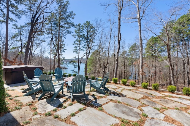 view of patio featuring a water view