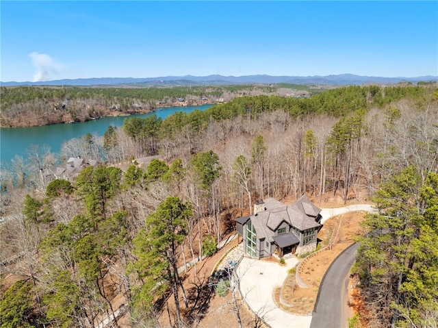 drone / aerial view featuring a water and mountain view