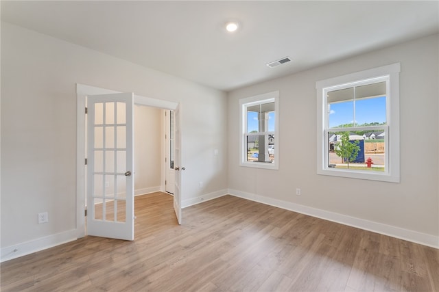 spare room featuring light hardwood / wood-style floors