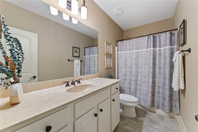 bathroom featuring walk in shower, vanity, toilet, and tile patterned floors