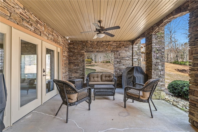 view of patio / terrace with ceiling fan, area for grilling, and an outdoor living space