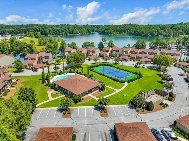 birds eye view of property with a water view