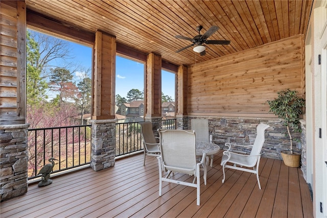 wooden terrace featuring ceiling fan