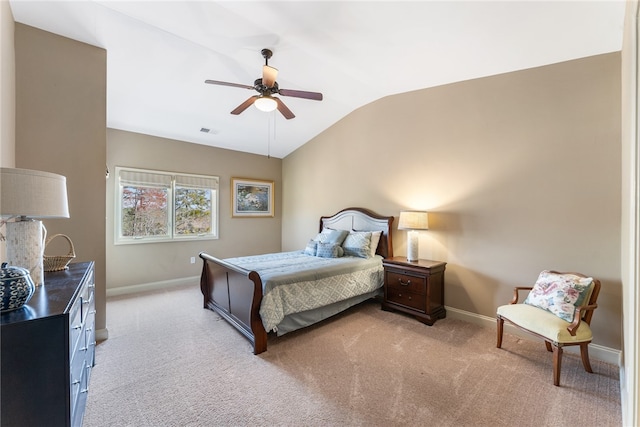 carpeted bedroom featuring lofted ceiling and ceiling fan