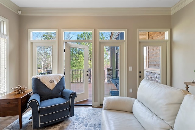 interior space with ornamental molding and hardwood / wood-style flooring