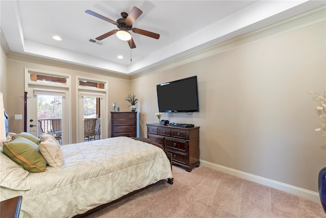 carpeted bedroom featuring ceiling fan, a raised ceiling, access to exterior, and crown molding