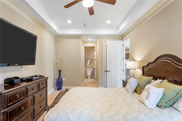 bedroom featuring light colored carpet, crown molding, ceiling fan, and ensuite bathroom