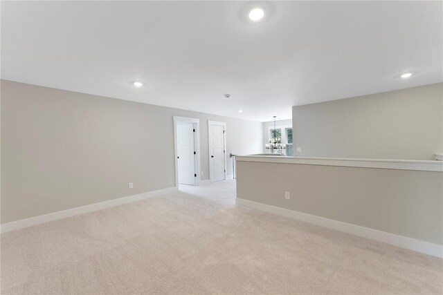 305 Breakwater Ln, Seneca, SC 29678 - empty room featuring a notable chandelier, baseboards, light colored carpet, and recessed lighting