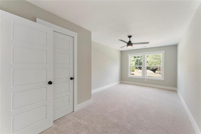 305 Breakwater Ln, Seneca, SC 29678 - unfurnished room with baseboards, ceiling fan, and light carpet
