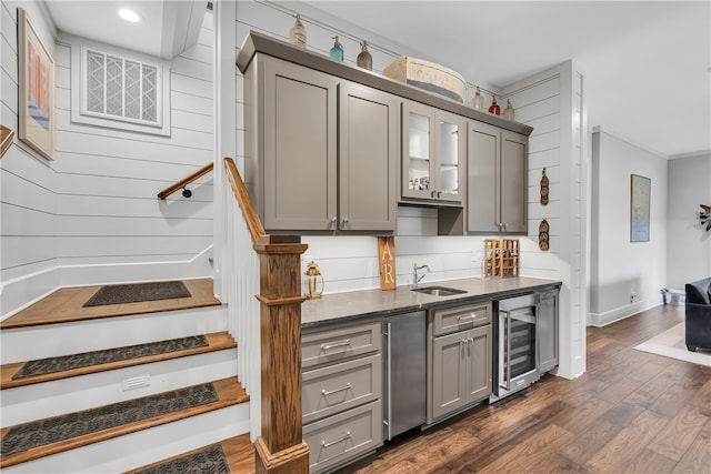 kitchen with gray cabinetry, sink, dark wood-type flooring, and wine cooler