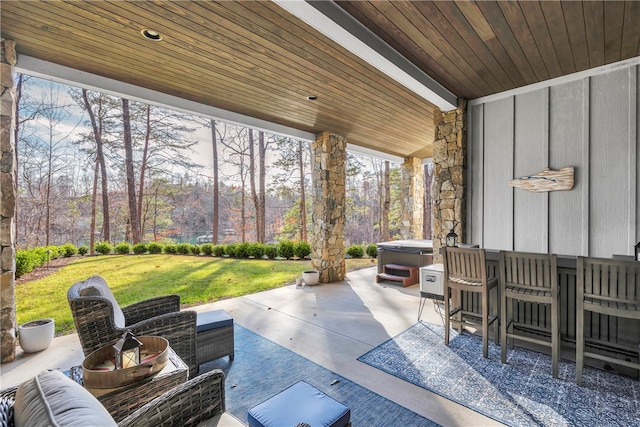 view of patio featuring an outdoor hangout area and a hot tub