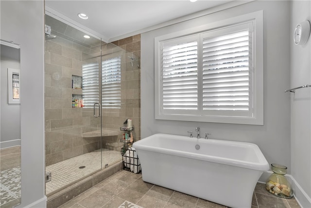 bathroom featuring independent shower and bath