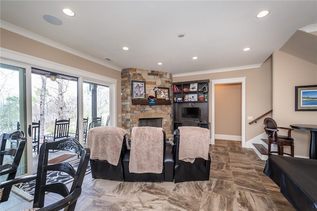 dining area featuring stairs, a fireplace, baseboards, and crown molding