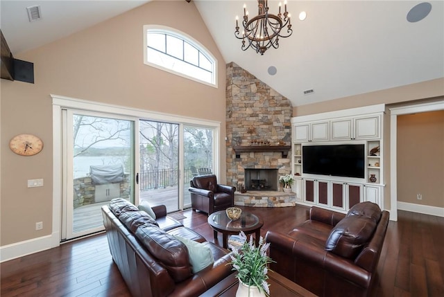 living area featuring baseboards, a fireplace, visible vents, and dark wood finished floors