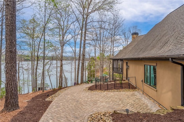 view of yard with a water view