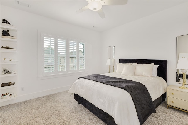 bedroom featuring ceiling fan and light colored carpet