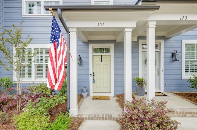 entrance to property featuring covered porch