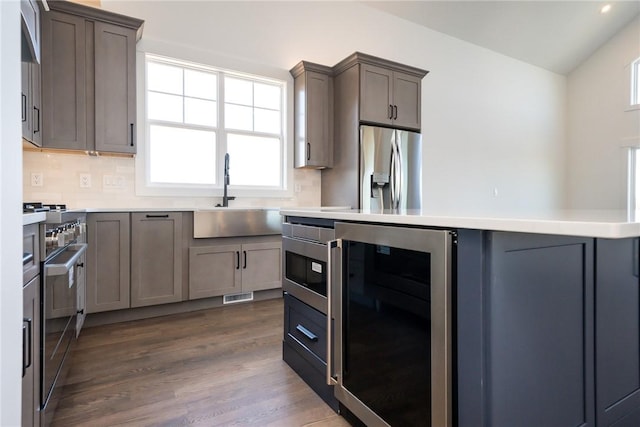 1230 Melton Rd Unit 211, West Union, SC 29696 - kitchen with appliances with stainless steel finishes, wine cooler, tasteful backsplash, and a sink