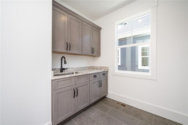 1230 Melton Rd Unit 211, West Union, SC 29696 - bar with visible vents, dark tile patterned flooring, baseboards, and a sink