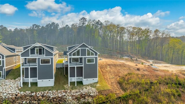 1230 Melton Rd Unit 211, West Union, SC 29696 - rear view of property with a balcony, a sunroom, and a view of trees