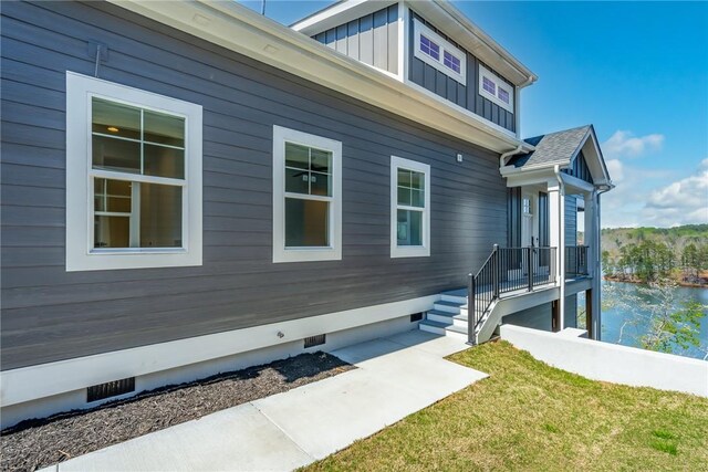 1230 Melton Rd Unit 211, West Union, SC 29696 - view of side of property featuring a yard, crawl space, a water view, and board and batten siding