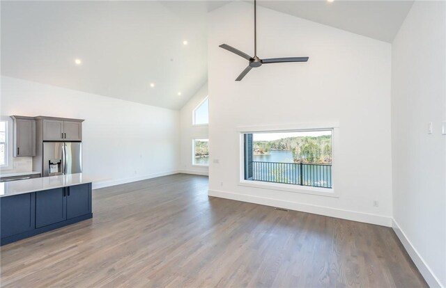 1230 Melton Rd Unit 211, West Union, SC 29696 - unfurnished living room with a ceiling fan, high vaulted ceiling, wood finished floors, and baseboards
